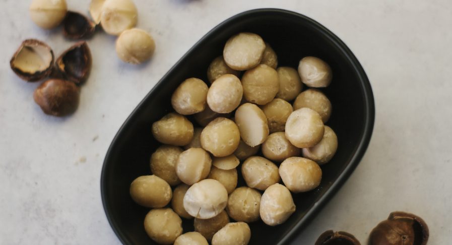 A bowl of freshly cracked macadamia kernels